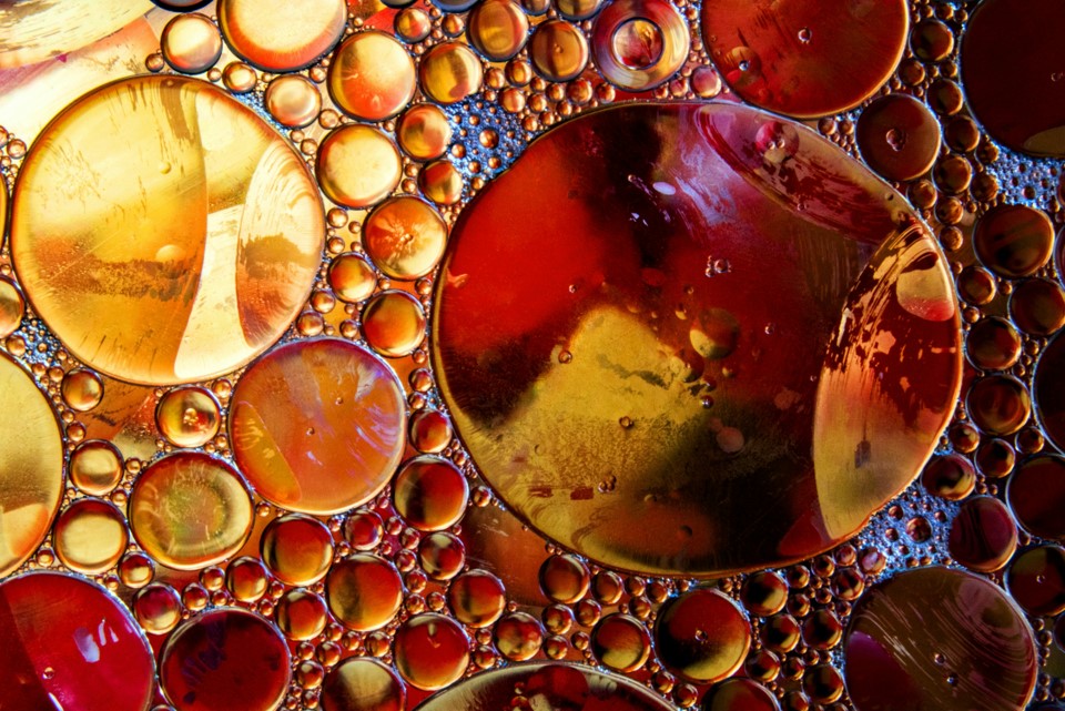 Vibrant collision of red and blue ink drops